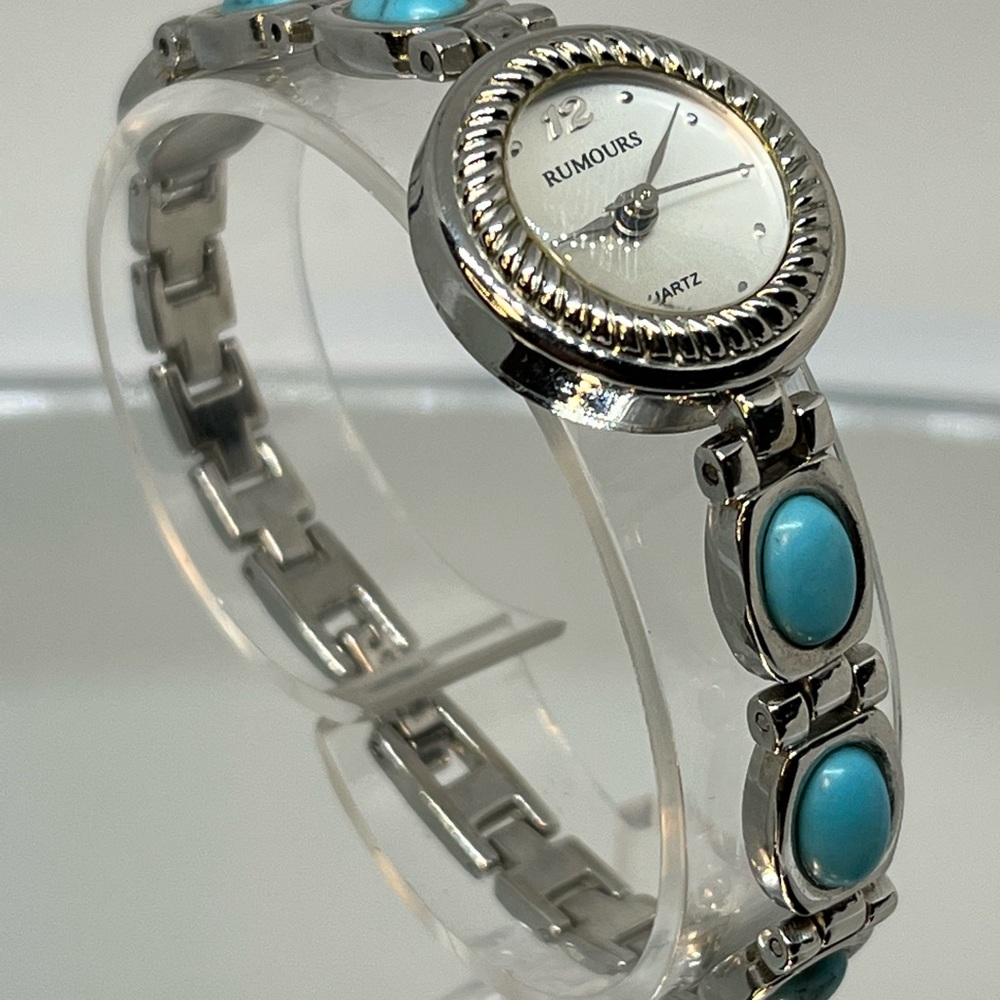 RUMORS! Very nice looking turquoise and silver toned elegant watch. Very pretty.